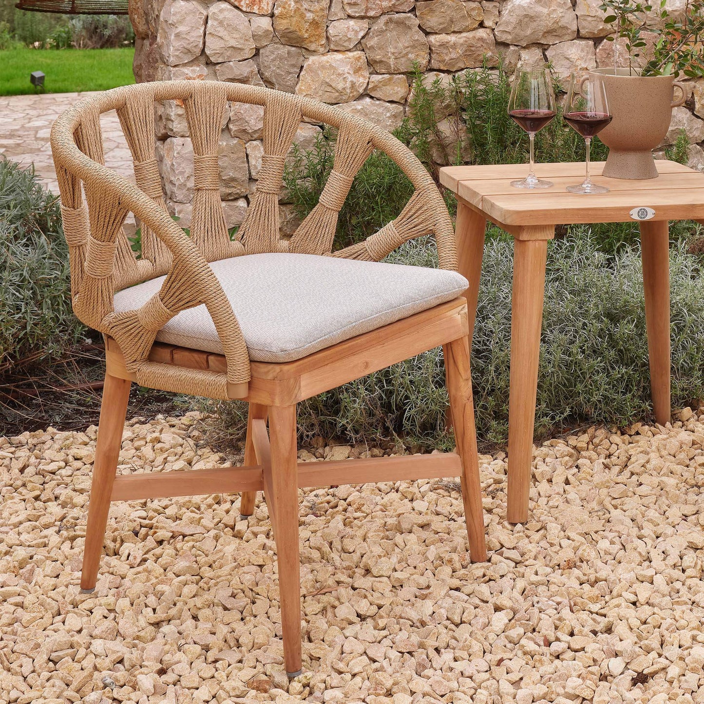 Outdoor dining armchair made from teak wood and polystrand rami natural rope