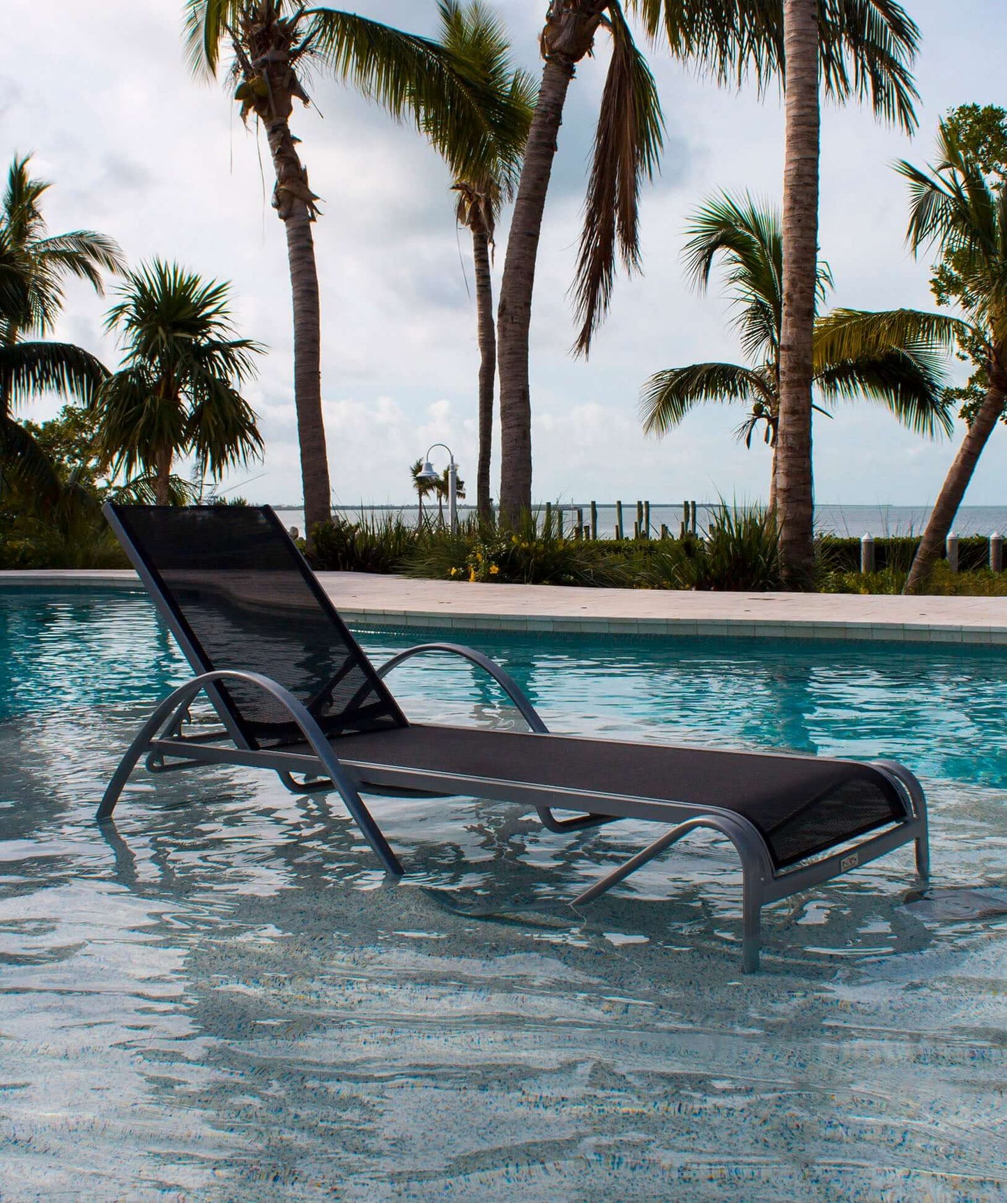 All weather proof chaise lounge with cushion made with HDPE synthetic wicker