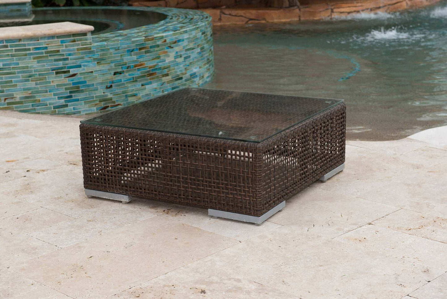 Modular outdoor coffee table made from anodized aluminum frame woven with Rehau Java Brown fiber and plexiglas
