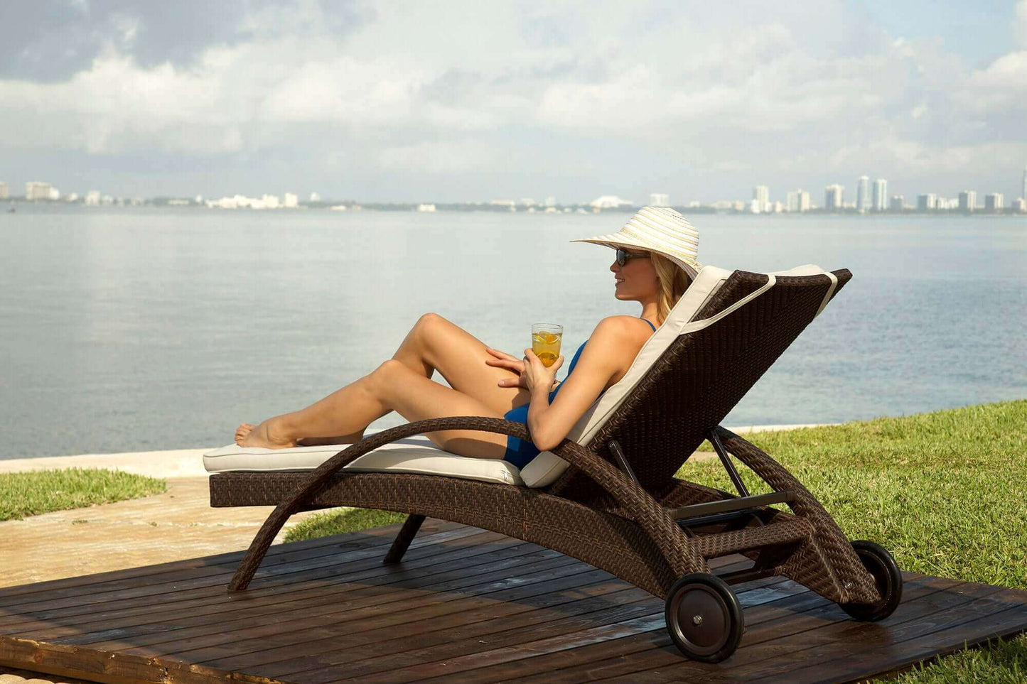 Chaise lounge chair made from aluminum frame woven with Rehau Java Brown fiber with cushion