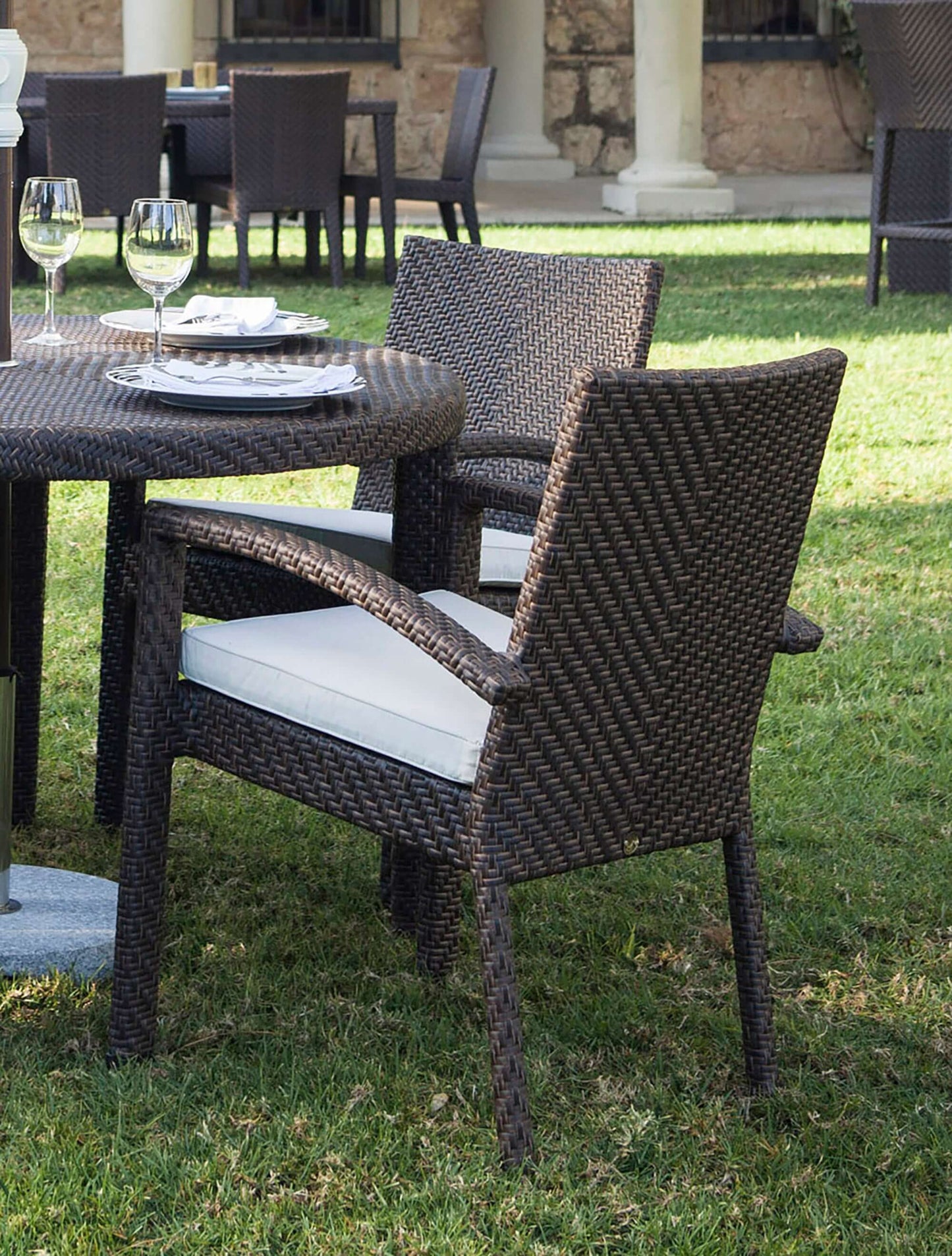 Outdoor stackable armchair with cushion