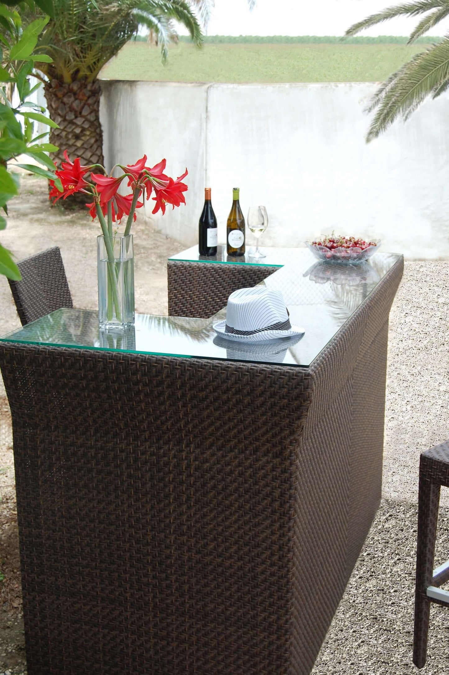 Contemporary outdoor bar with Plexiglas underneath wicker weave