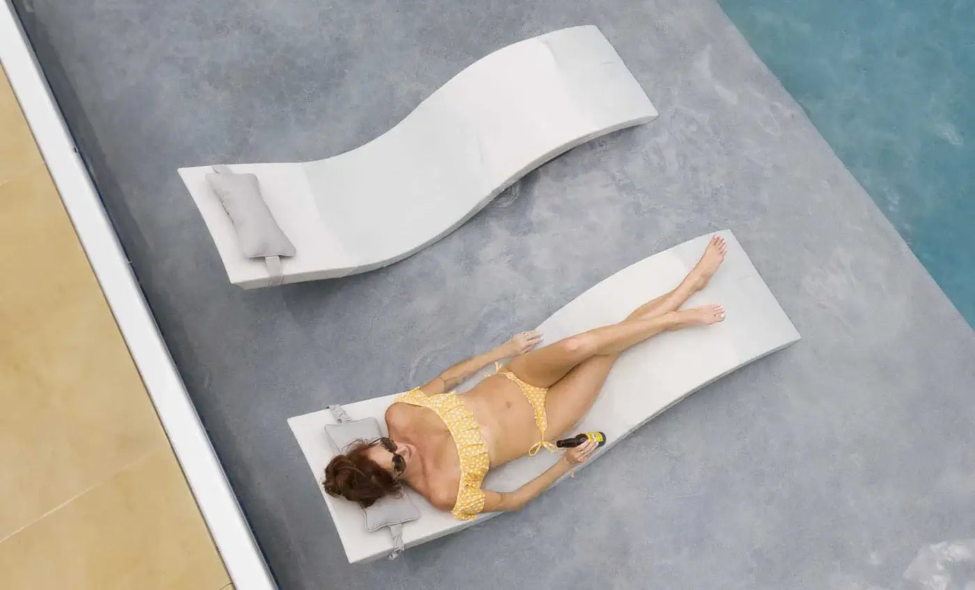 This luxurious set includes two Signature In-Pool Chaise Loungers and two matching Headrest Pillows, designed for ultimate comfort on your pool’s tanning ledge, baja shelf, or sun shelf with water depths of 0-9 inches.