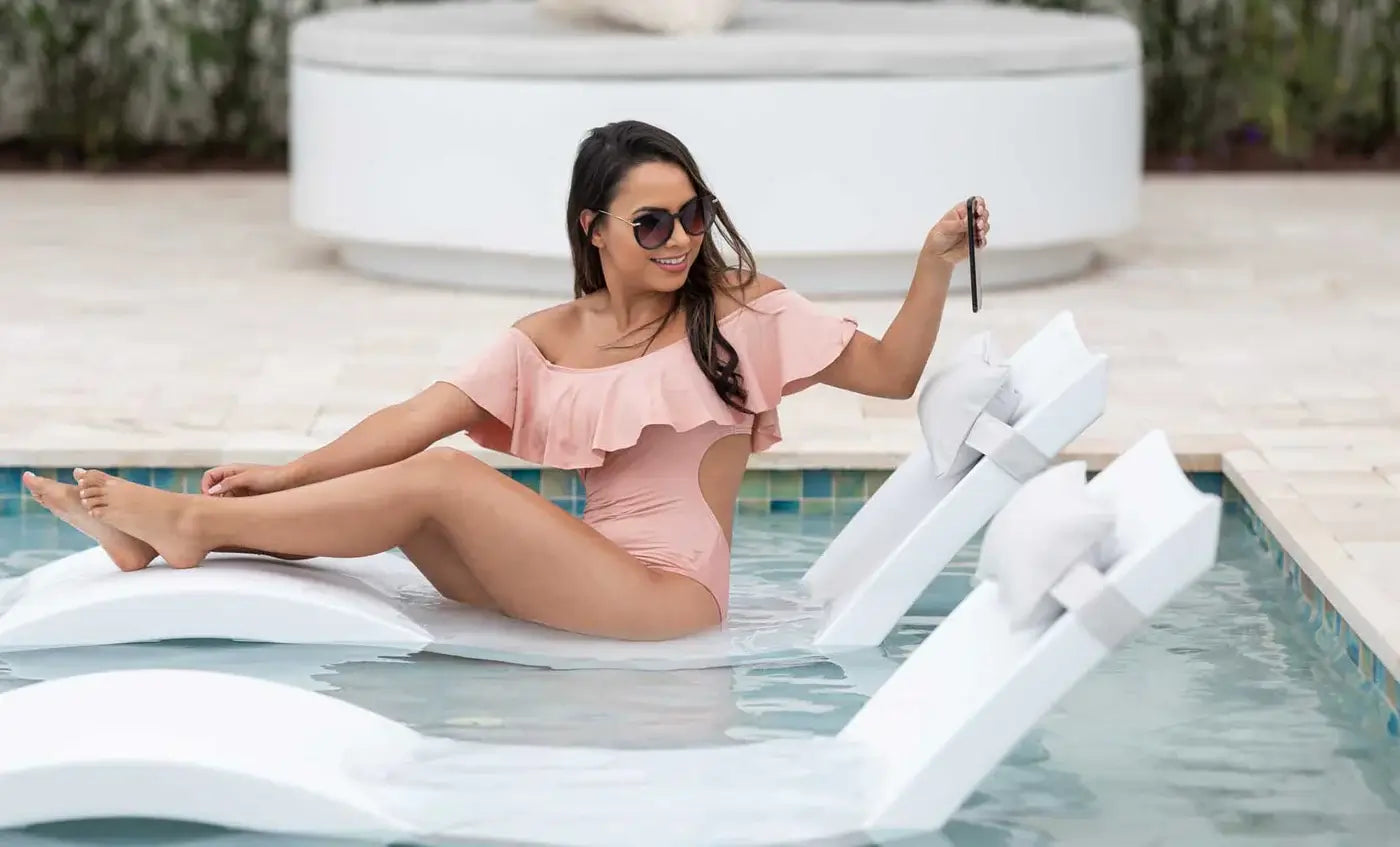 This luxurious set includes two Signature In-Pool Chaise Loungers and two matching Headrest Pillows, designed for ultimate comfort on your pool’s tanning ledge, baja shelf, or sun shelf with water depths of 0-9 inches.