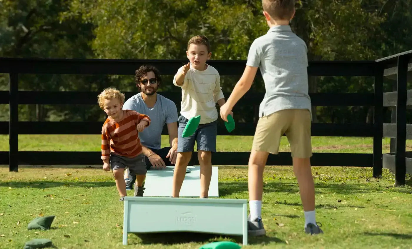 Whether you call it cornhole, bean bag toss, or tailgate toss, this complete set—featuring two durable boards and two sets of four resin-filled bean bags in your choice of colors.