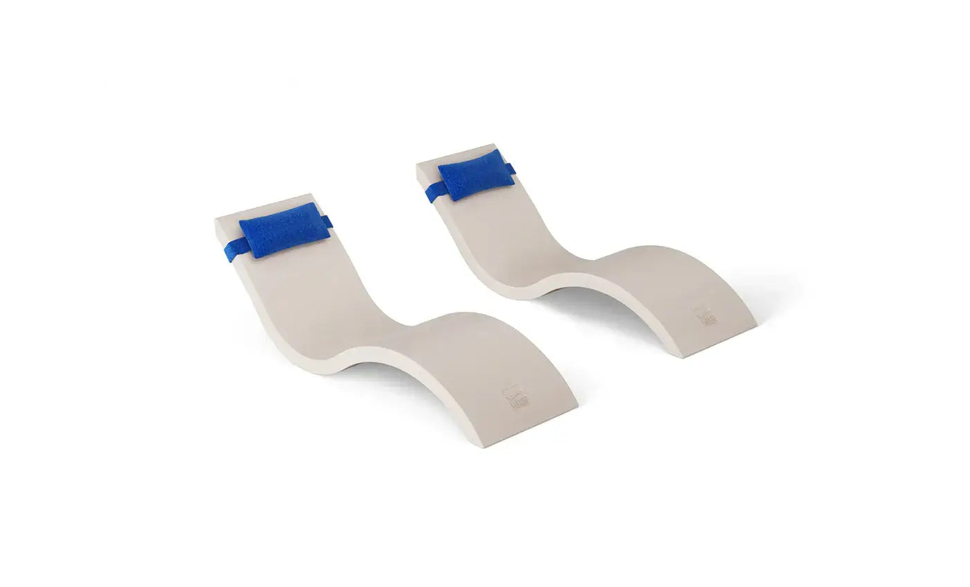 This luxurious set includes two Signature In-Pool Chaise Loungers and two matching Headrest Pillows, designed for ultimate comfort on your pool’s tanning ledge, baja shelf, or sun shelf with water depths of 0-9 inches.