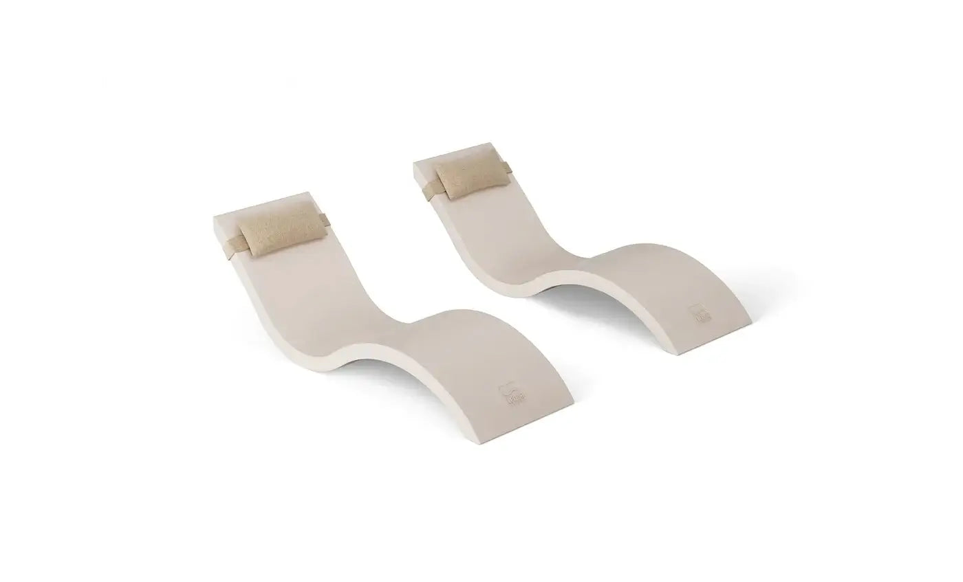 This luxurious set includes two Signature In-Pool Chaise Loungers and two matching Headrest Pillows, designed for ultimate comfort on your pool’s tanning ledge, baja shelf, or sun shelf with water depths of 0-9 inches.