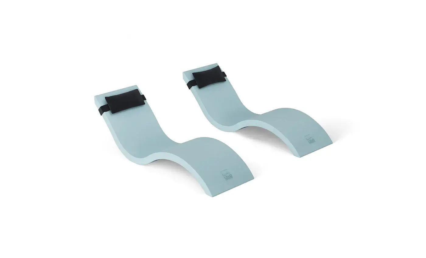 This luxurious set includes two Signature In-Pool Chaise Loungers and two matching Headrest Pillows, designed for ultimate comfort on your pool’s tanning ledge, baja shelf, or sun shelf with water depths of 0-9 inches.