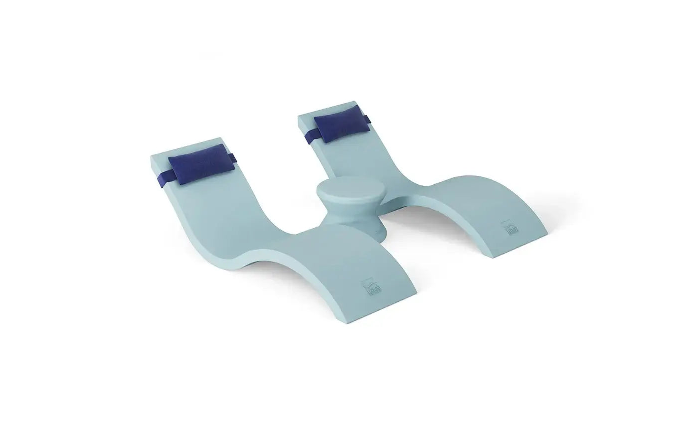 Designed for tanning ledges, baja shelves, or sun shelves with water depths up to 9 inches, this set includes two Signature In-Pool Chaise Loungers, two plush Headrest Pillows, and a versatile Side Table.