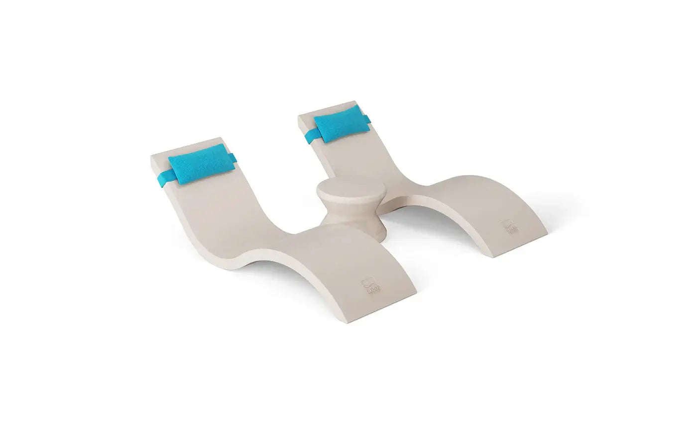 Designed for tanning ledges, baja shelves, or sun shelves with water depths up to 9 inches, this set includes two Signature In-Pool Chaise Loungers, two plush Headrest Pillows, and a versatile Side Table.