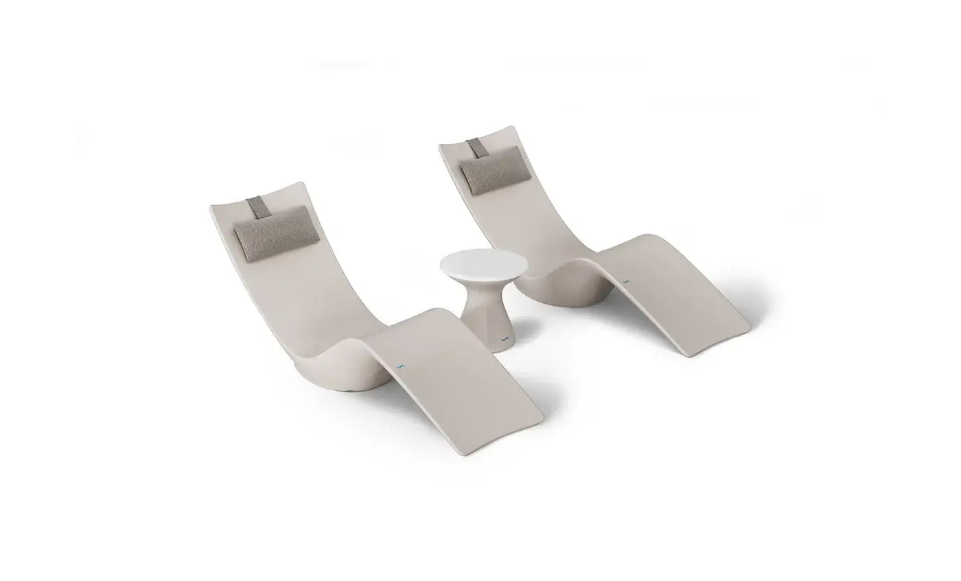 This premium set includes two Autograph In-Pool Chaise Loungers, two plush Headrest Pillows, and a sleek Autograph Standard Side Table, offering everything you need to create a sophisticated outdoor oasis.