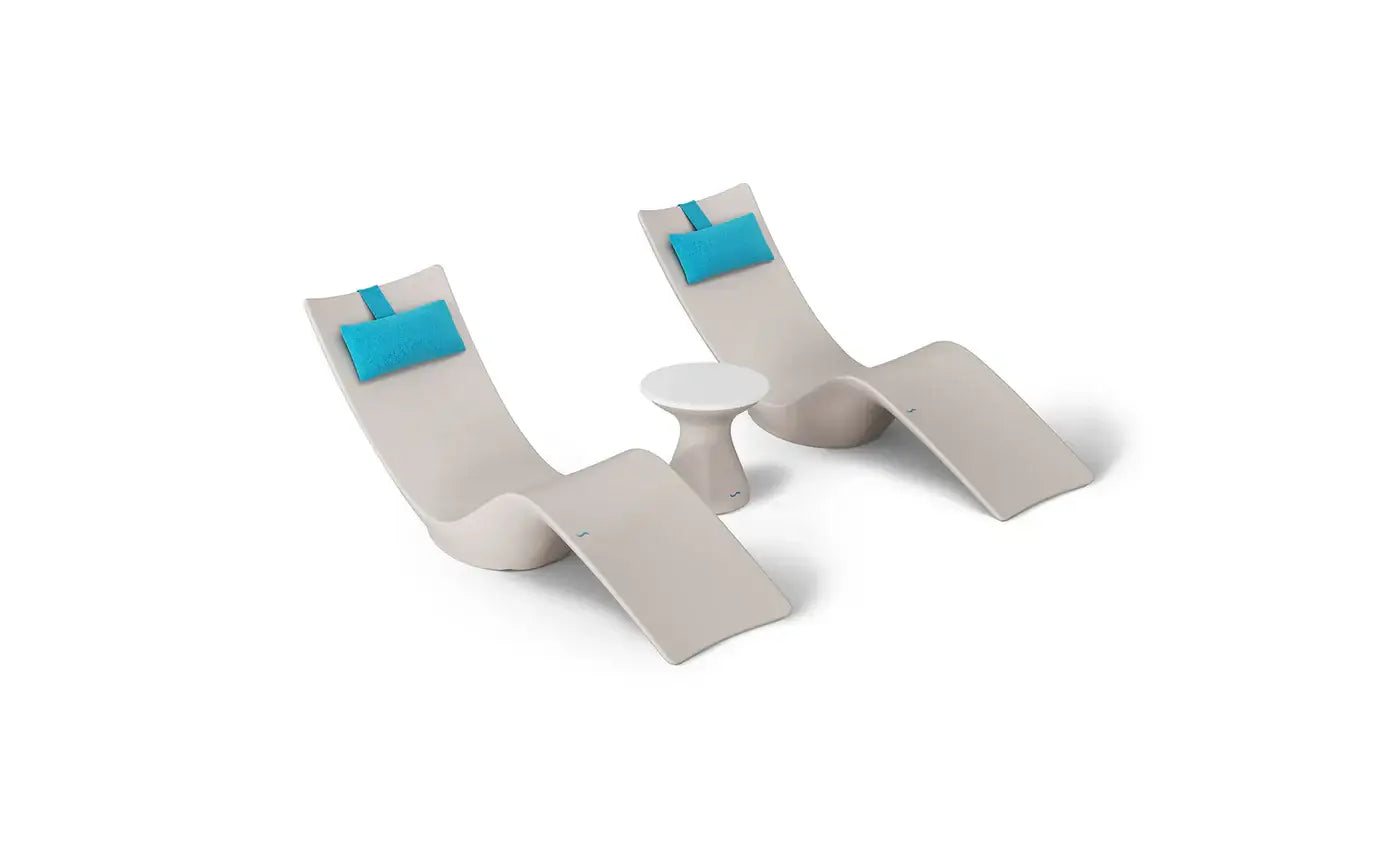 This premium set includes two Autograph In-Pool Chaise Loungers, two plush Headrest Pillows, and a sleek Autograph Standard Side Table, offering everything you need to create a sophisticated outdoor oasis.