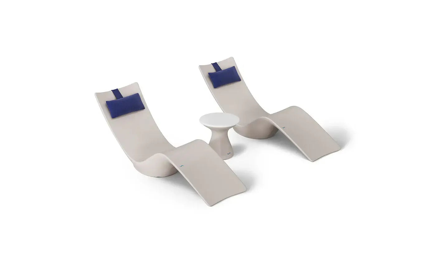 This premium set includes two Autograph In-Pool Chaise Loungers, two plush Headrest Pillows, and a sleek Autograph Standard Side Table, offering everything you need to create a sophisticated outdoor oasis.