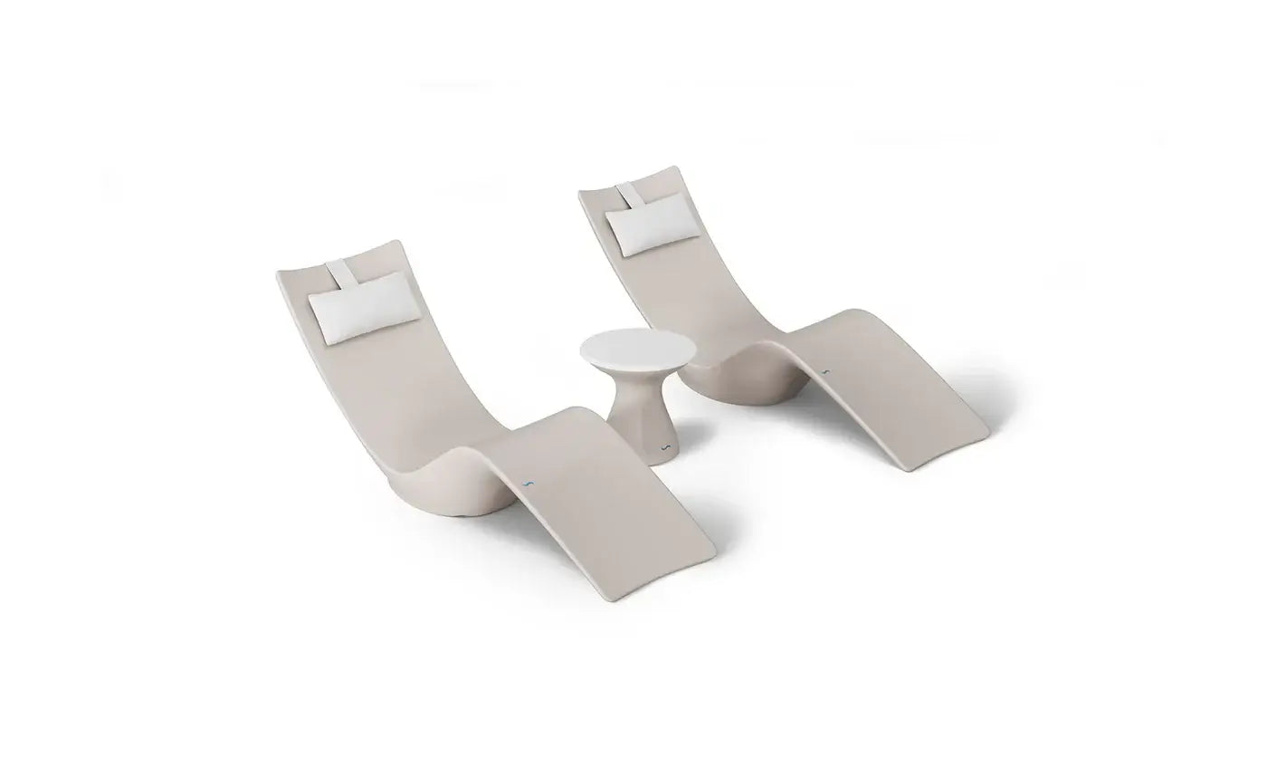 This premium set includes two Autograph In-Pool Chaise Loungers, two plush Headrest Pillows, and a sleek Autograph Standard Side Table, offering everything you need to create a sophisticated outdoor oasis.