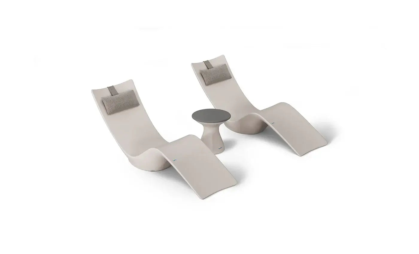 This premium set includes two Autograph In-Pool Chaise Loungers, two plush Headrest Pillows, and a sleek Autograph Standard Side Table, offering everything you need to create a sophisticated outdoor oasis.