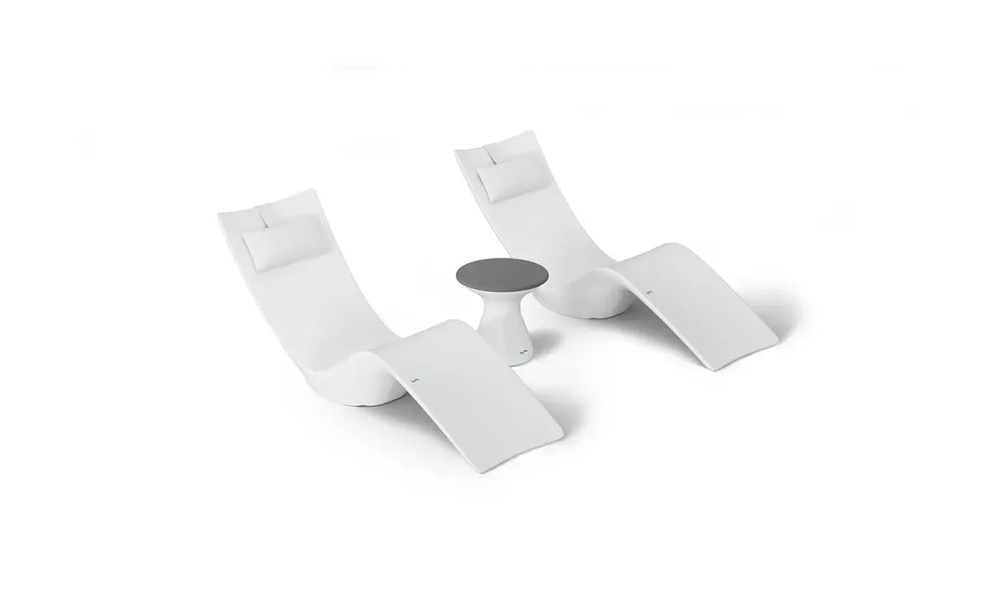 This premium set includes two Autograph In-Pool Chaise Loungers, two plush Headrest Pillows, and a sleek Autograph Standard Side Table, offering everything you need to create a sophisticated outdoor oasis.