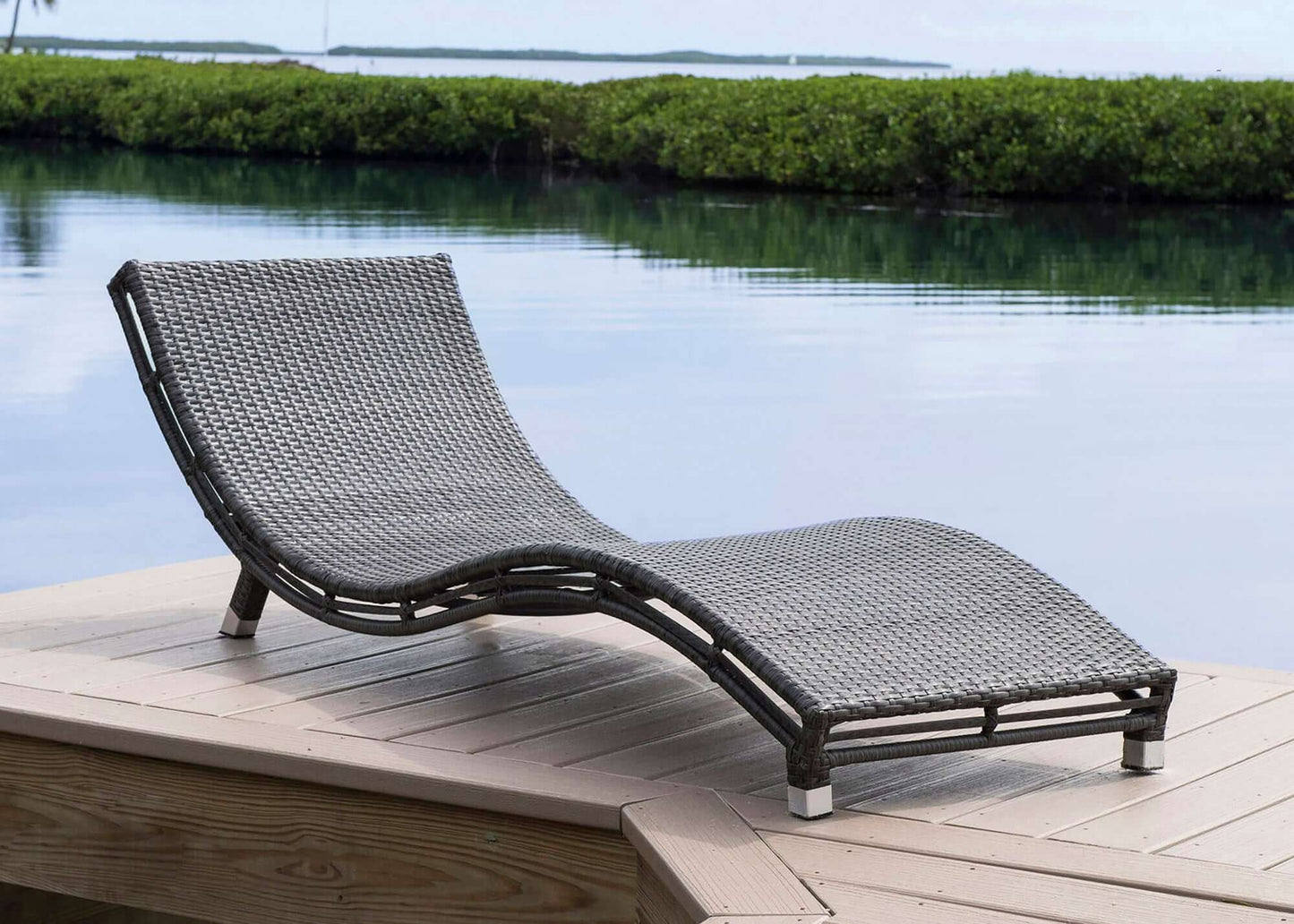 Panama Jack curved outdoor chaise lounge with cushion