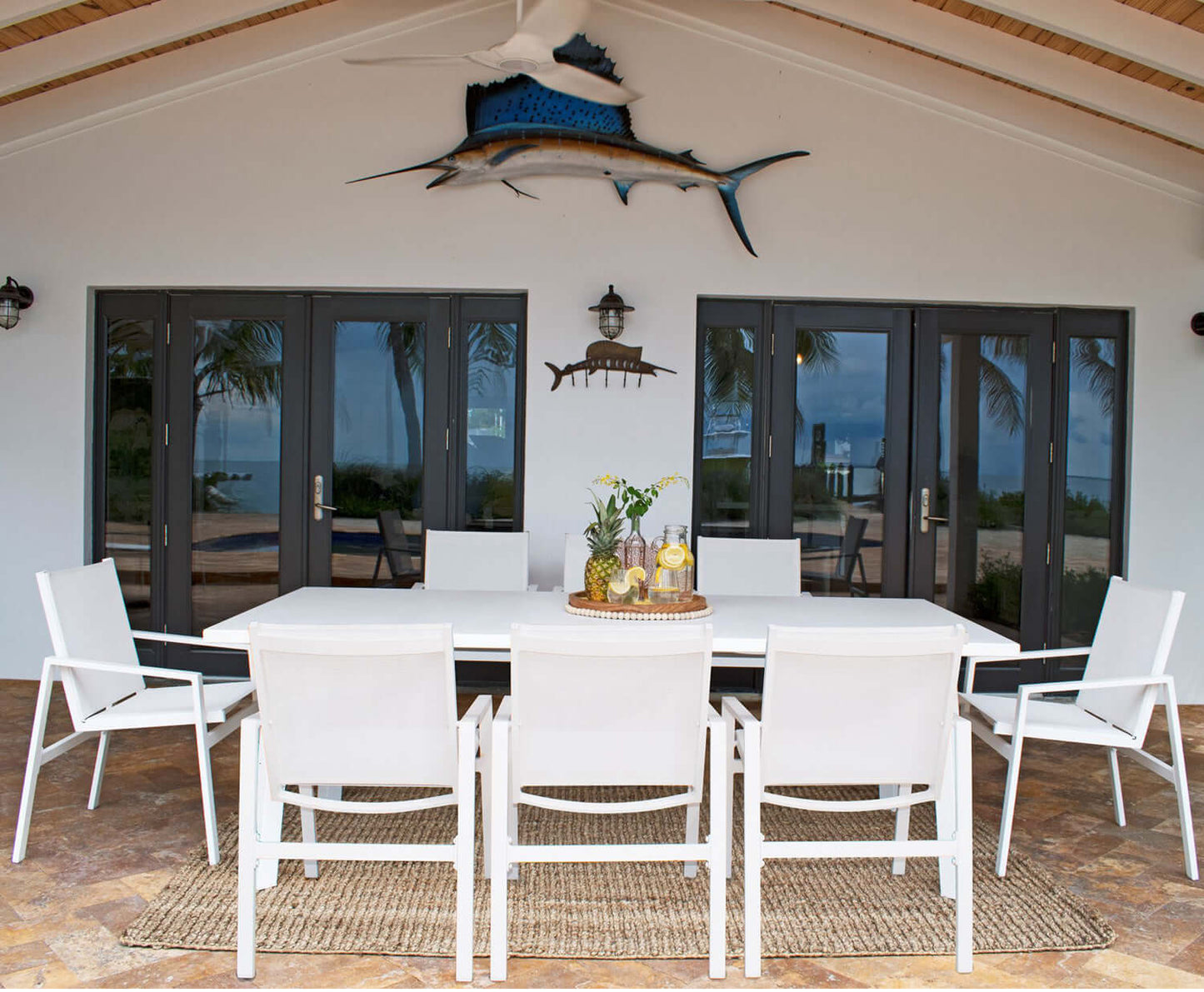 Panama Jack 9-piece rectangular outdoor dining set made with strong powder-coated finish resistant to corroding and scratching