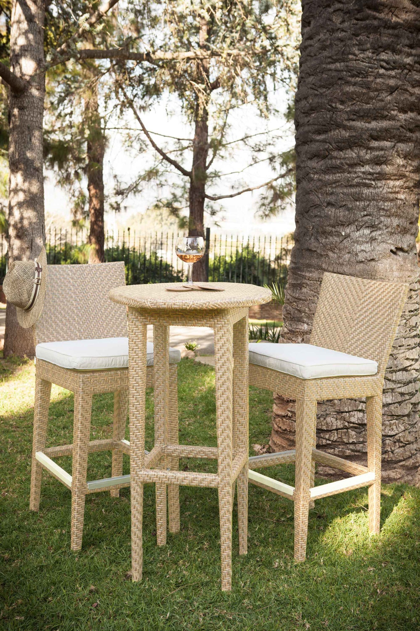 Panama Jack 3-piece outdoor round pub table set crafted with aluminum frames and commercial quality fiber weaving with cushion