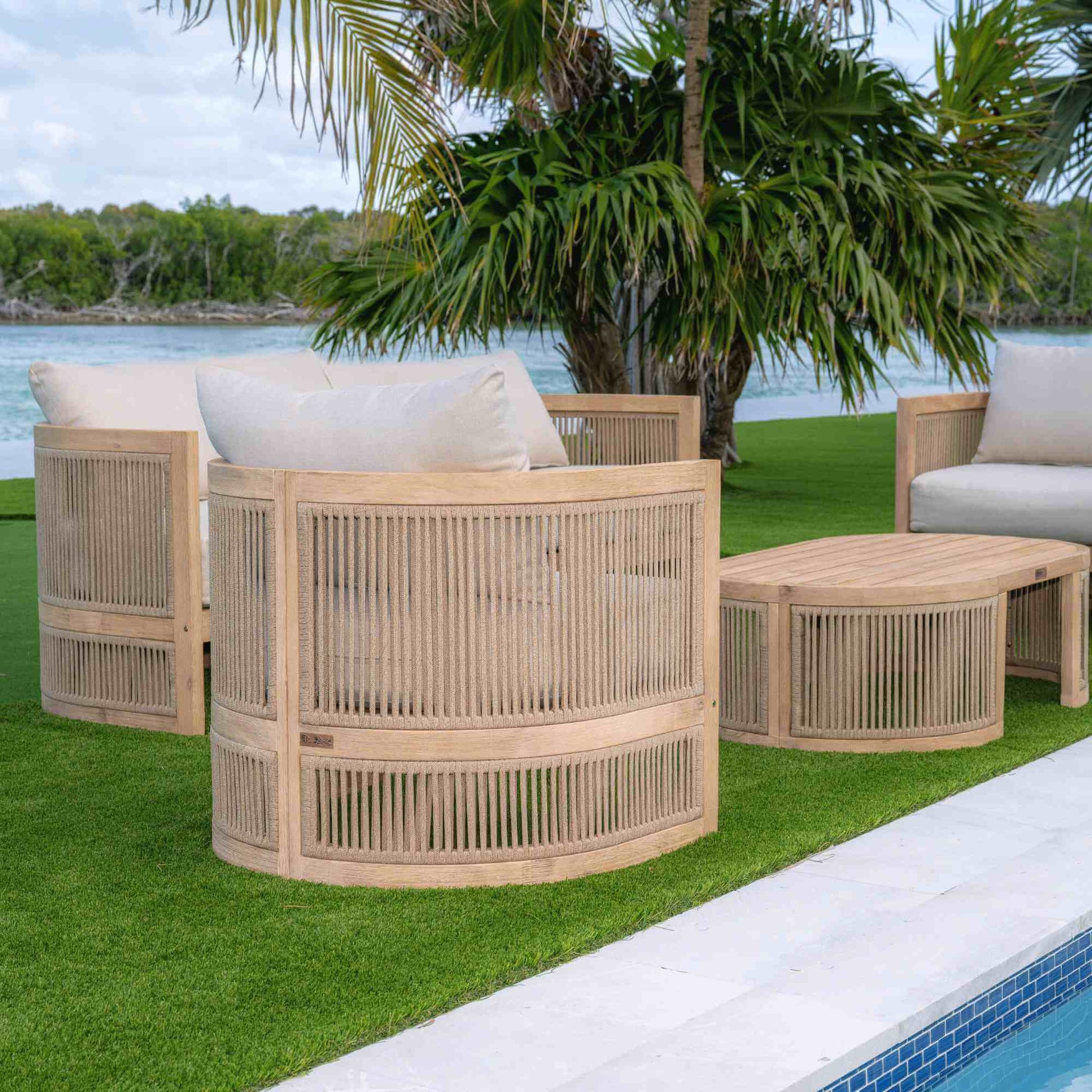 Panama Jack 4-piece outdoor loveseat seating set made with Acacia wood for a natural wood finish with outdoor cushions