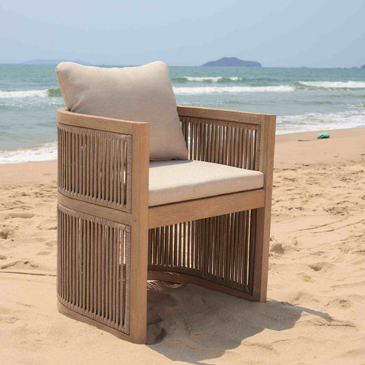 Panama Jack outdoor barrel dining armchair made with Acacia wood for a natural wood finish with cushions