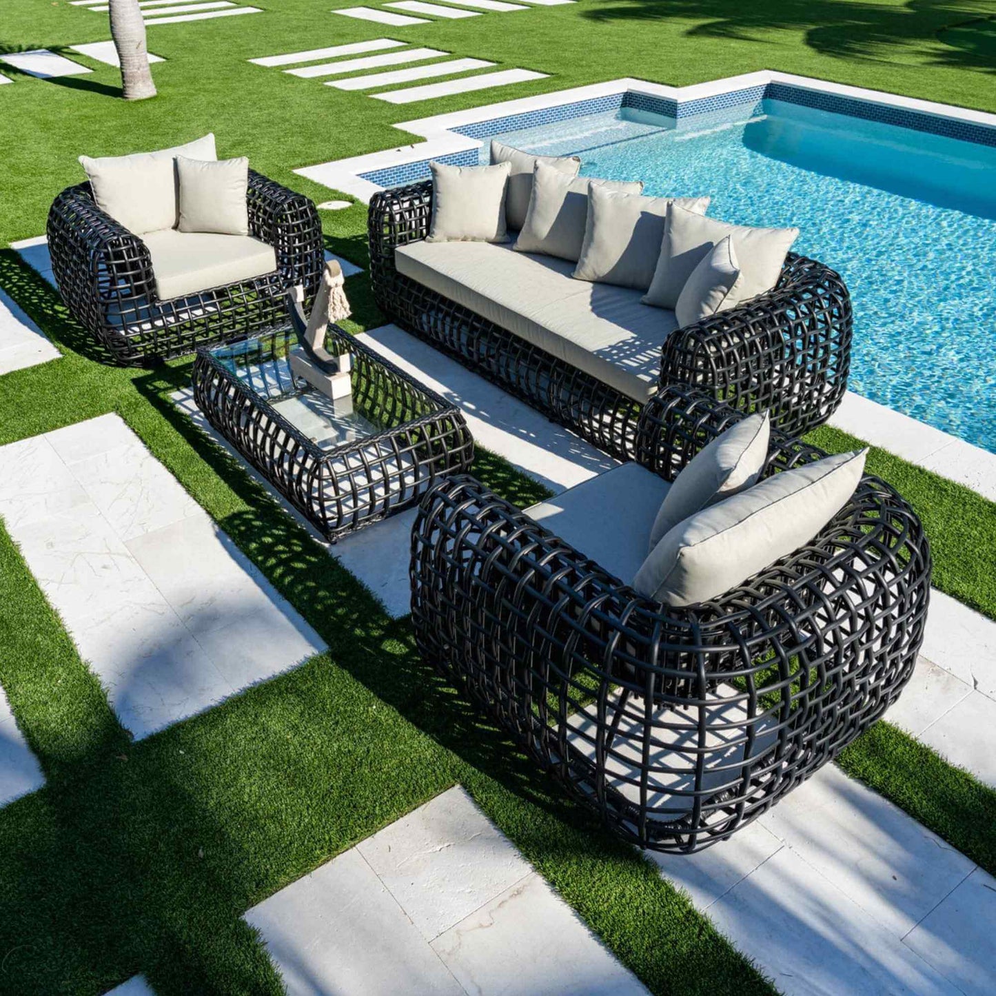Black synthetic wicker 4-piece outdoor seating set made with weather-resistant materials