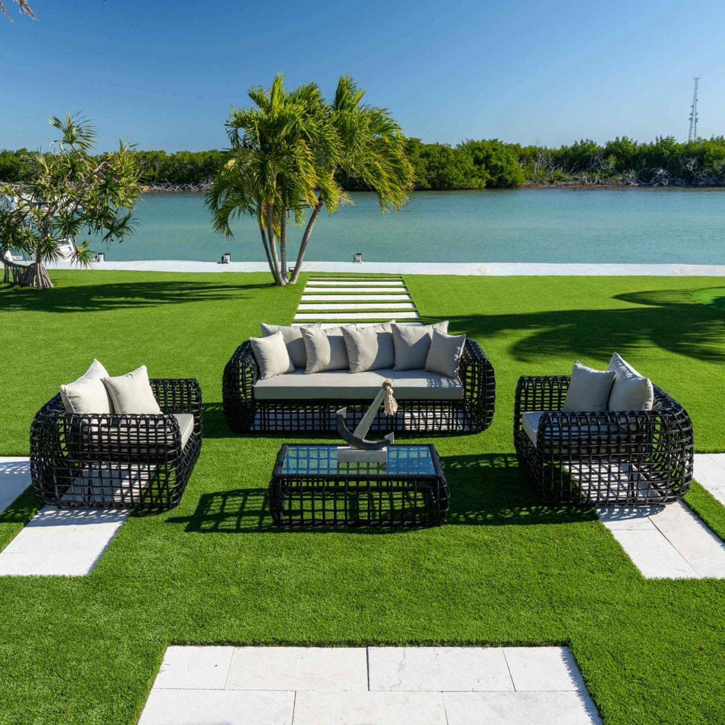 Black synthetic wicker 4-piece outdoor seating set made with weather-resistant materials
