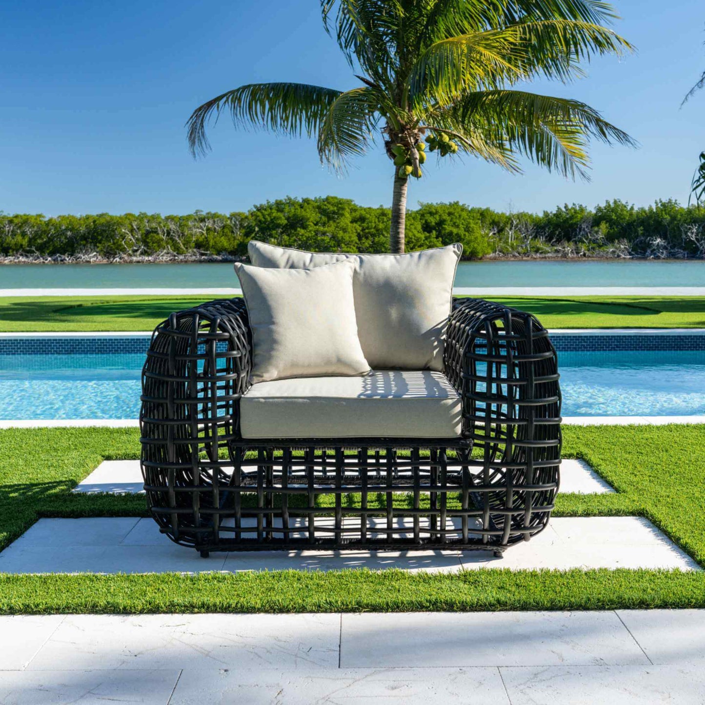 Black synthetic wicker outdoor lounge chair