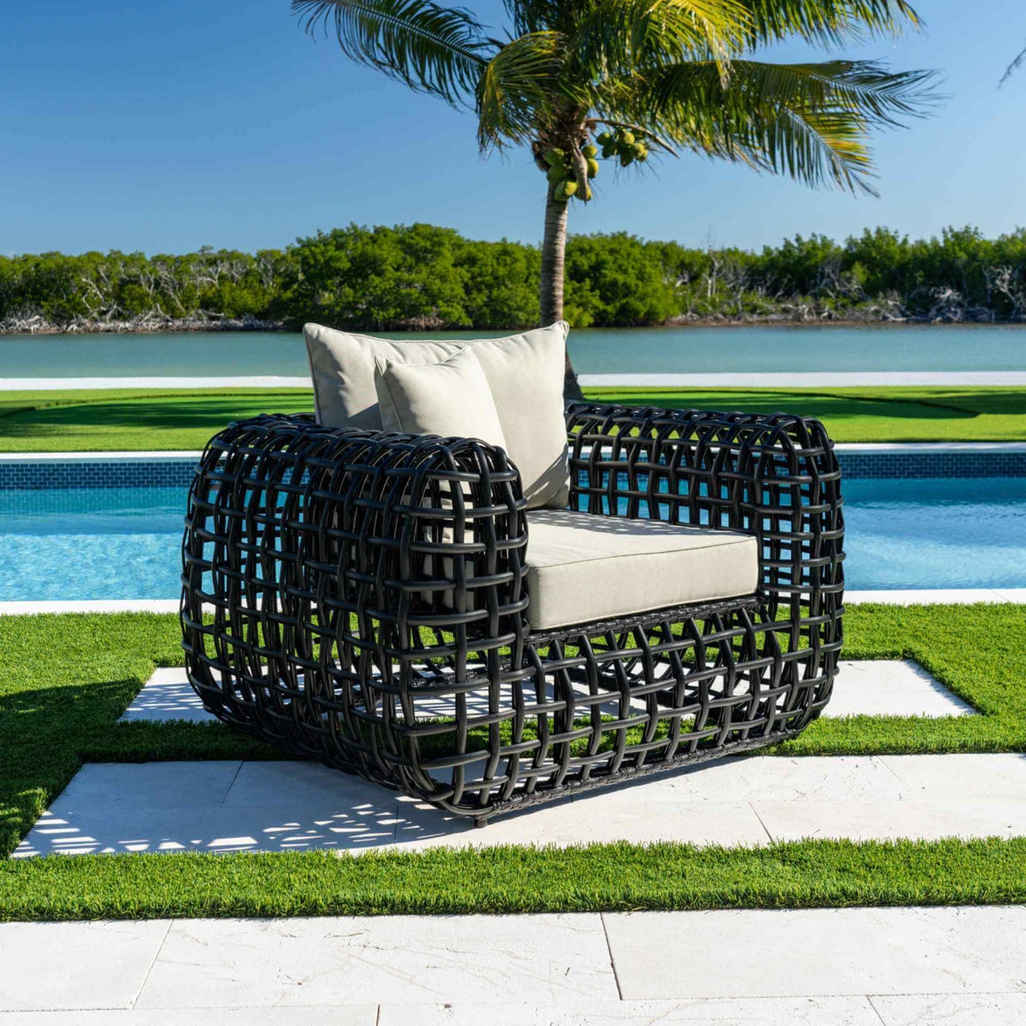 Black synthetic wicker outdoor lounge chair