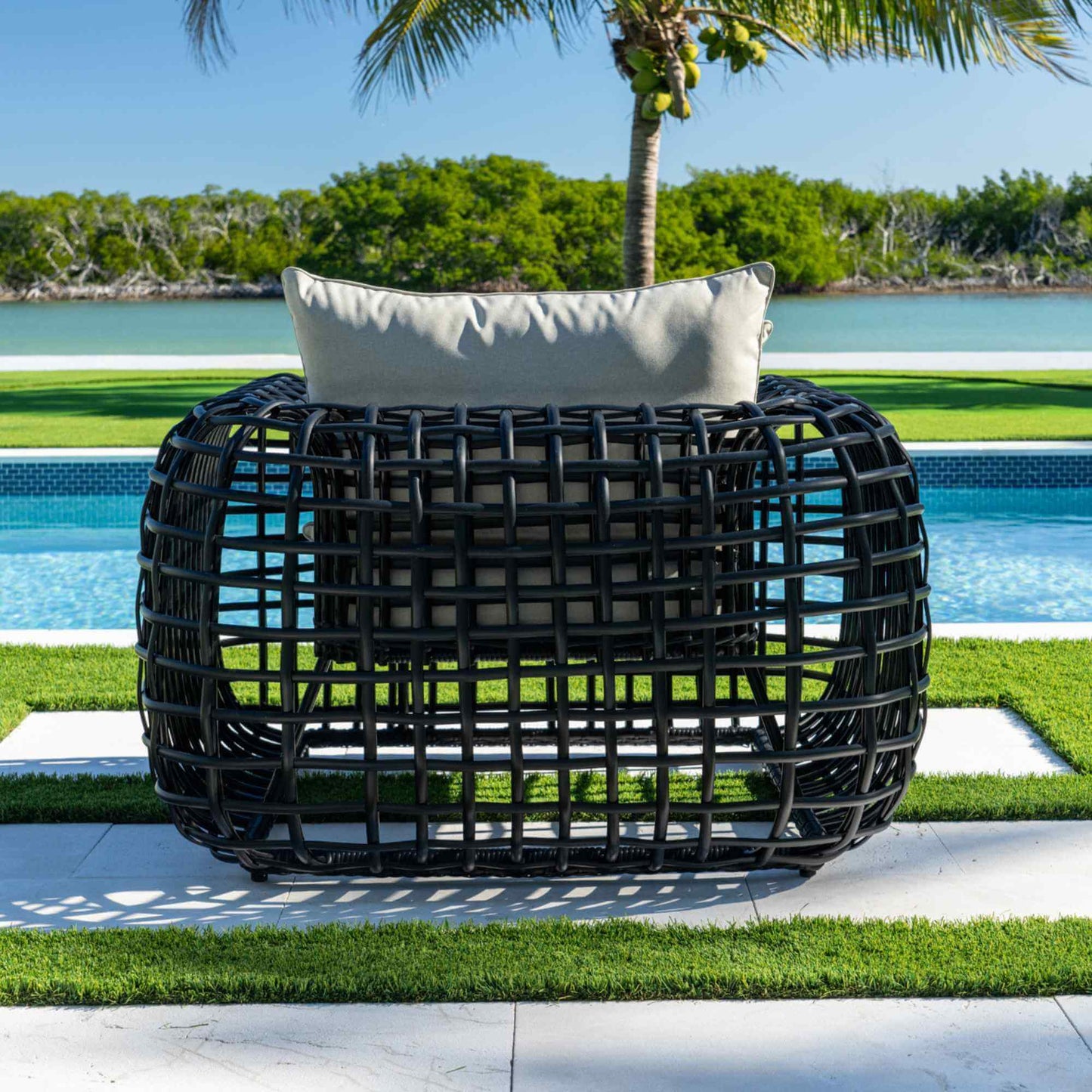 Black synthetic wicker outdoor lounge chair