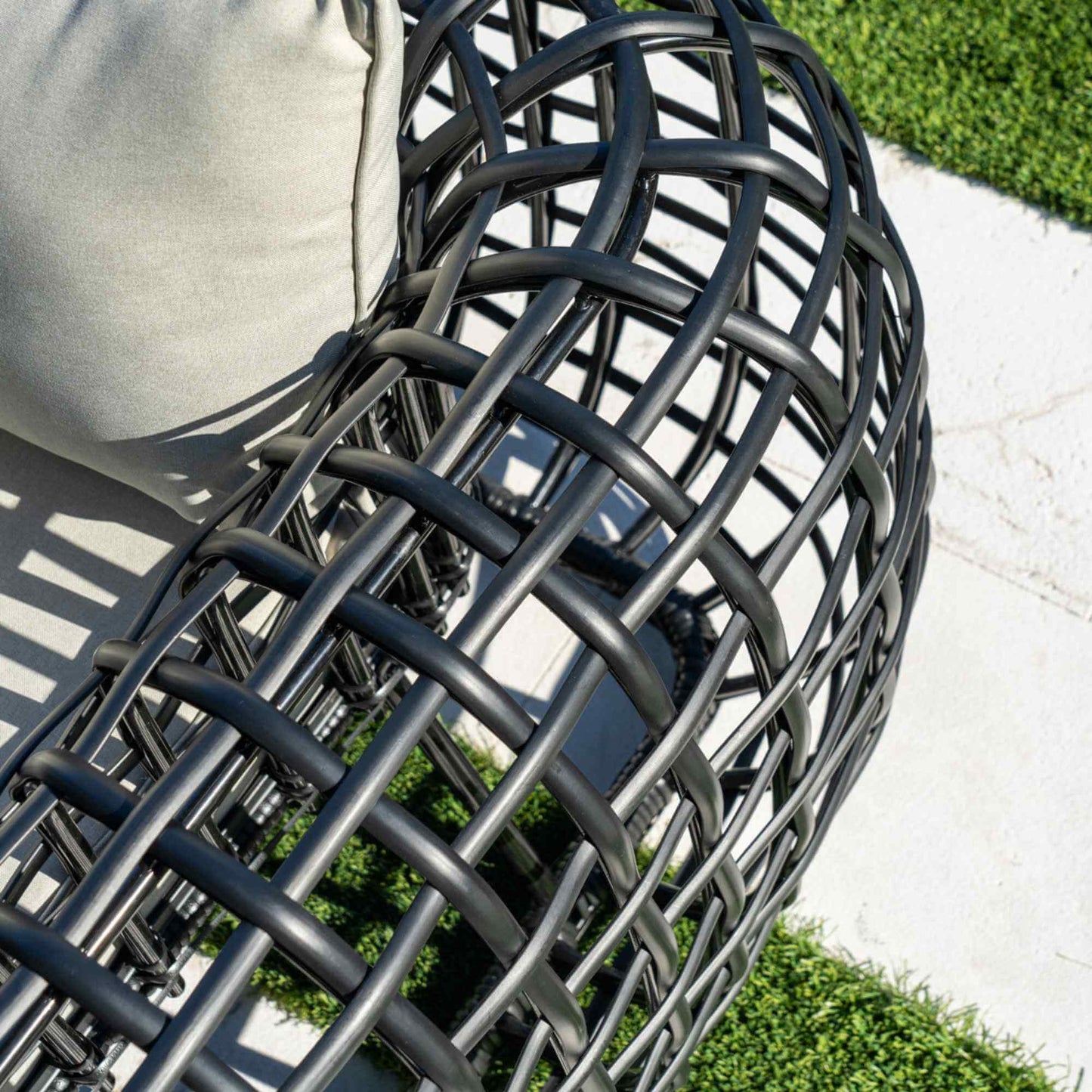 Black synthetic wicker outdoor sofa
