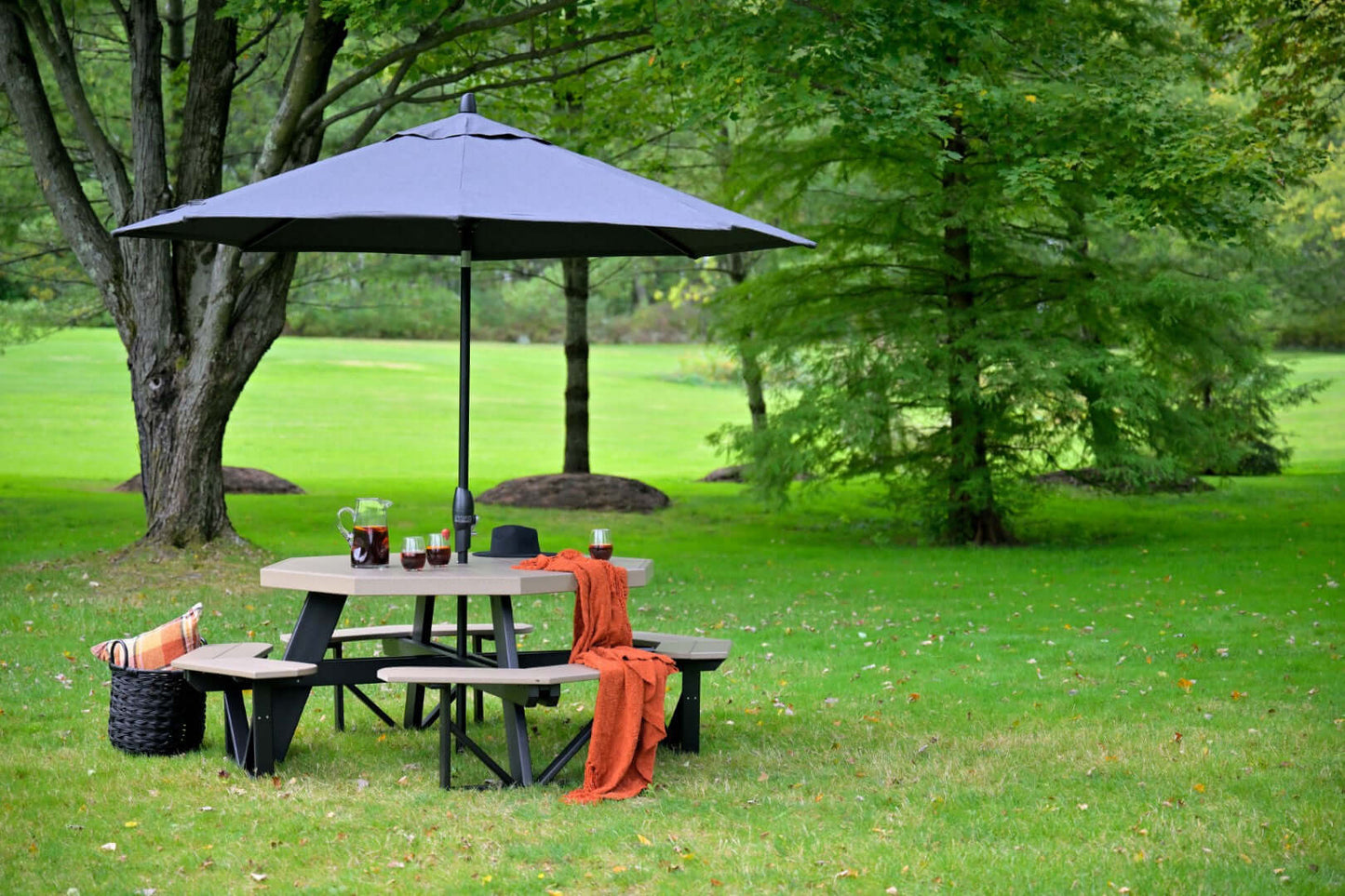 LuxCraft Octagon Outdoor Picnic Table designed to seat eight with standard umbrella hole