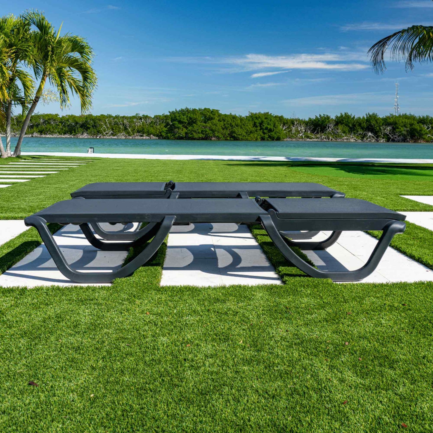Black set of 2 outdoor sling chaise loungers that are commercial-grade quality for durability and heavy use