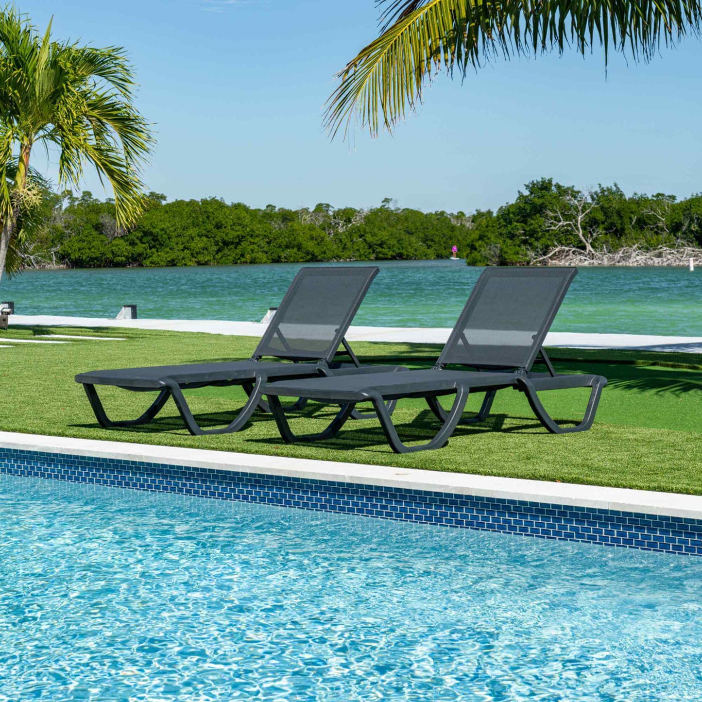 Black set of 2 outdoor sling chaise loungers that are commercial-grade quality for durability and heavy use