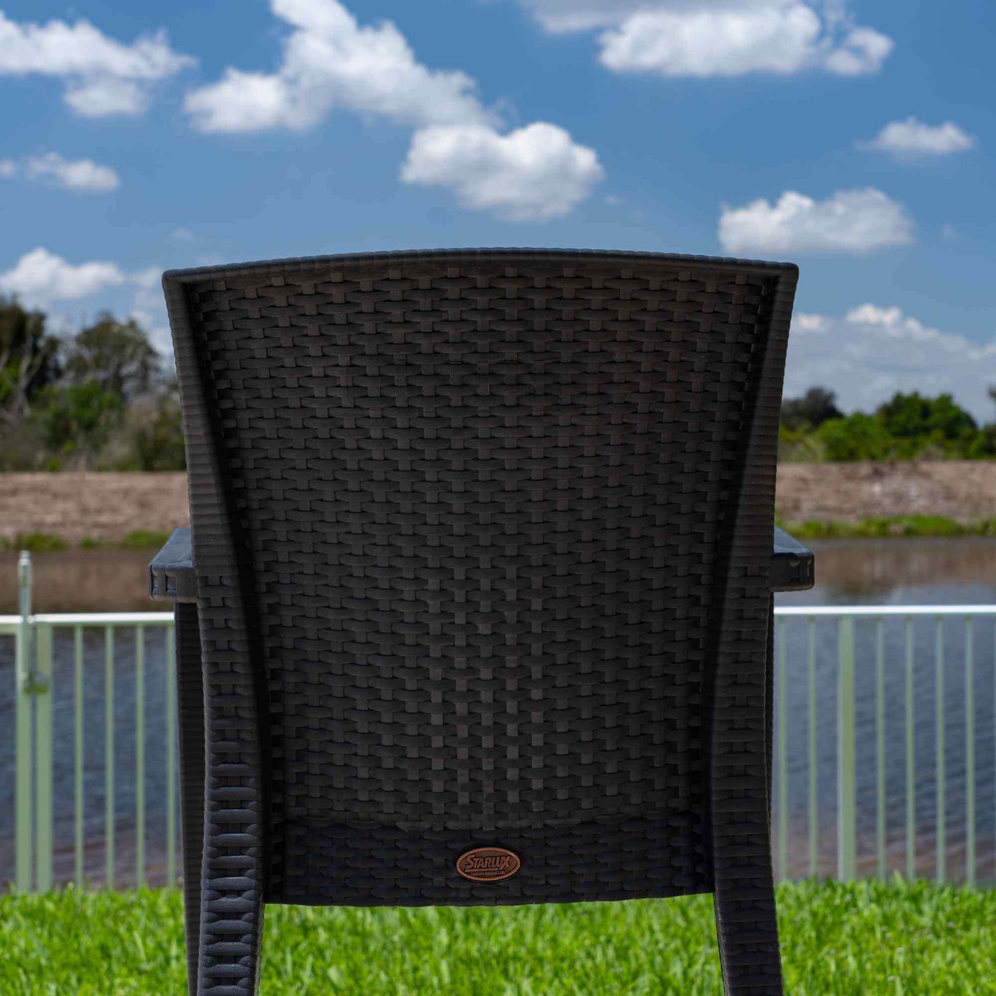 Black 5-piece outdoor dining set includes 1 square table and 4 wicker stackable armchairs