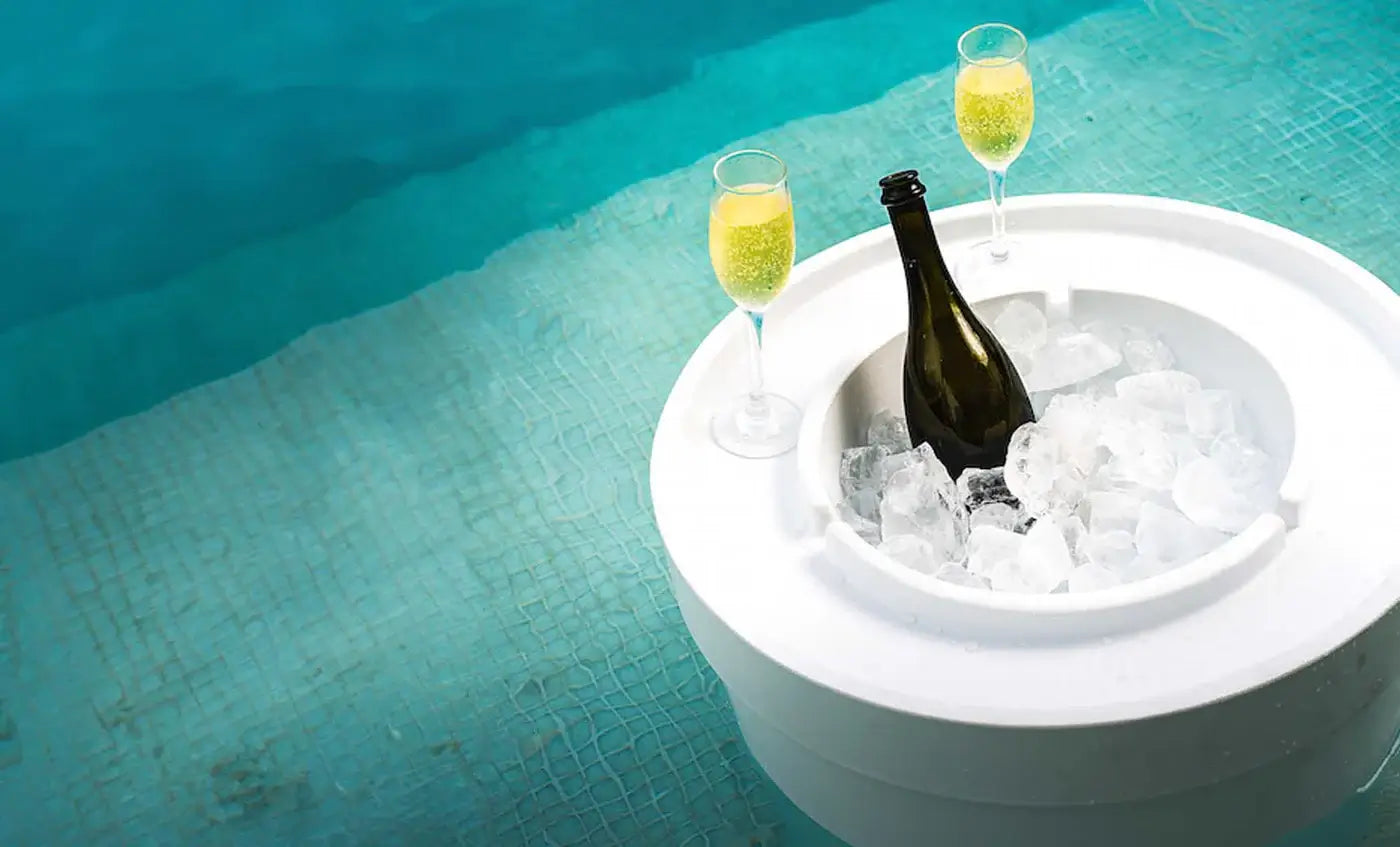 This multi-purpose accessory serves as a side table, beverage cooler, and umbrella base, designed for sun shelves, tanning ledges, or decks with water depths up to 15 inches.