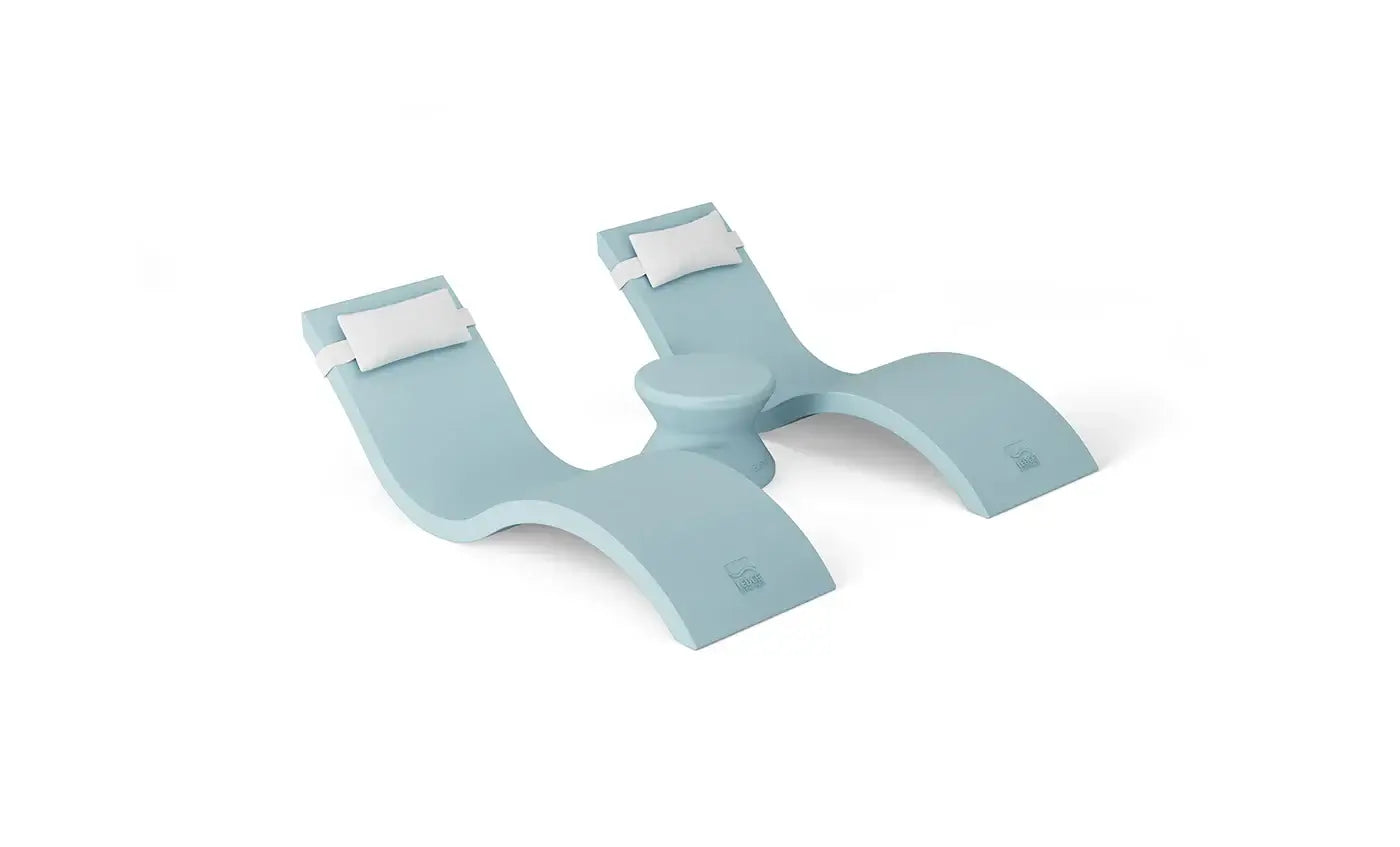 Designed for tanning ledges, baja shelves, or sun shelves with water depths up to 9 inches, this set includes two Signature In-Pool Chaise Loungers, two plush Headrest Pillows, and a versatile Side Table.