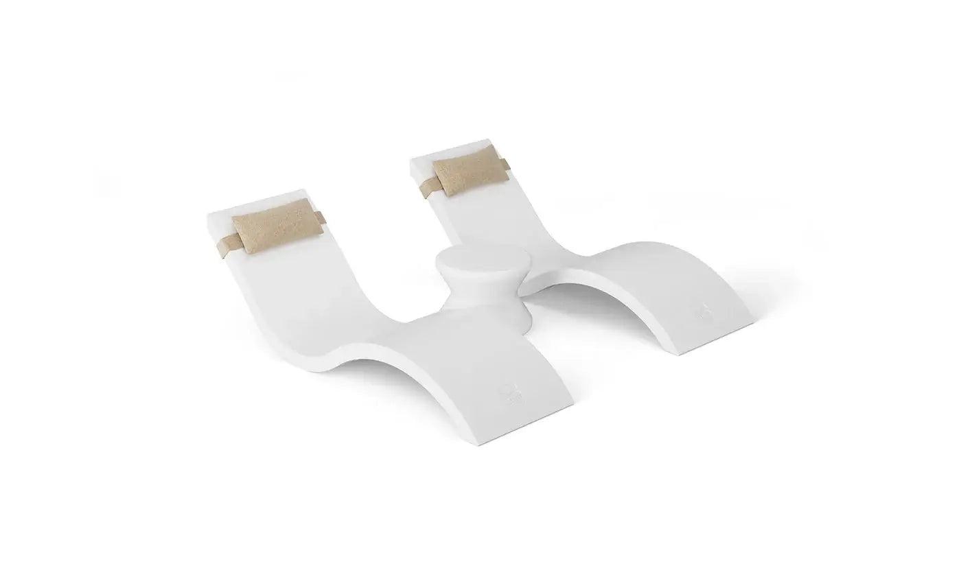 Designed for tanning ledges, baja shelves, or sun shelves with water depths up to 9 inches, this set includes two Signature In-Pool Chaise Loungers, two plush Headrest Pillows, and a versatile Side Table.