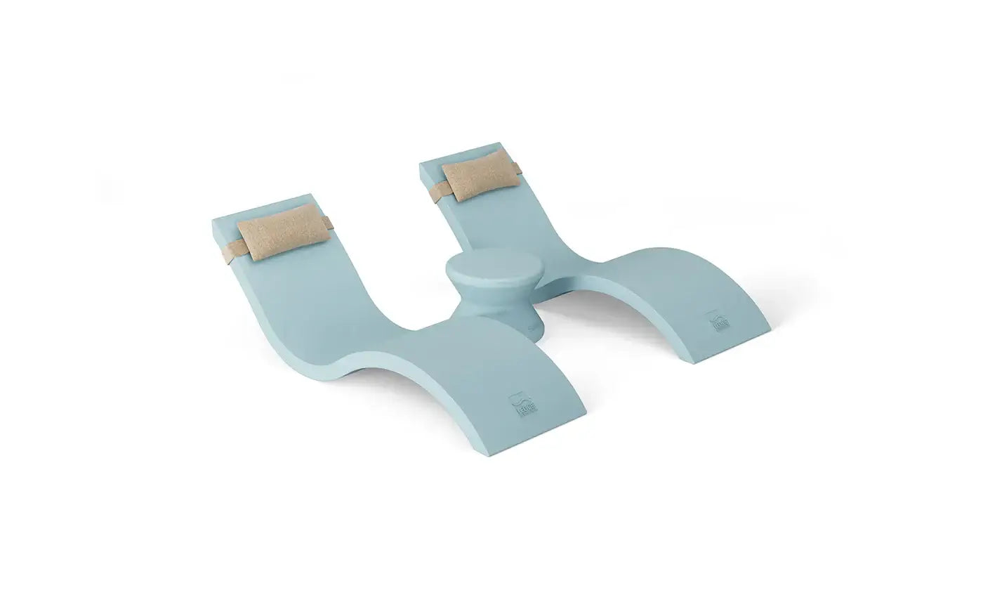 Designed for tanning ledges, baja shelves, or sun shelves with water depths up to 9 inches, this set includes two Signature In-Pool Chaise Loungers, two plush Headrest Pillows, and a versatile Side Table.