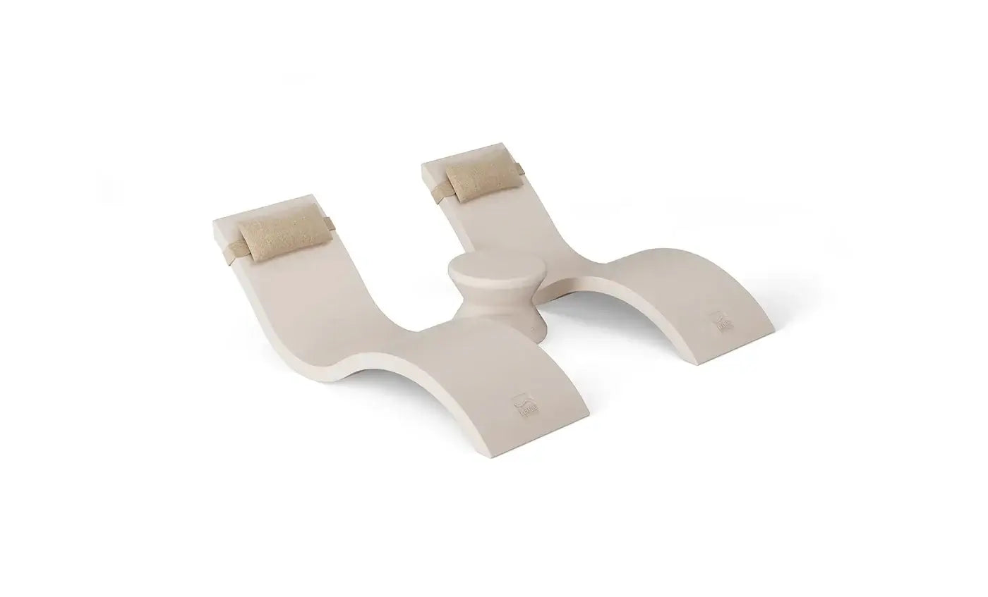 Designed for tanning ledges, baja shelves, or sun shelves with water depths up to 9 inches, this set includes two Signature In-Pool Chaise Loungers, two plush Headrest Pillows, and a versatile Side Table.
