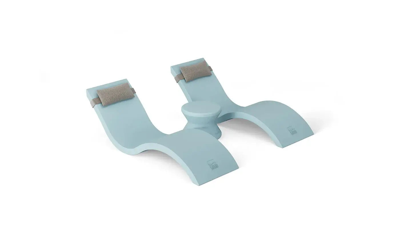 Designed for tanning ledges, baja shelves, or sun shelves with water depths up to 9 inches, this set includes two Signature In-Pool Chaise Loungers, two plush Headrest Pillows, and a versatile Side Table.