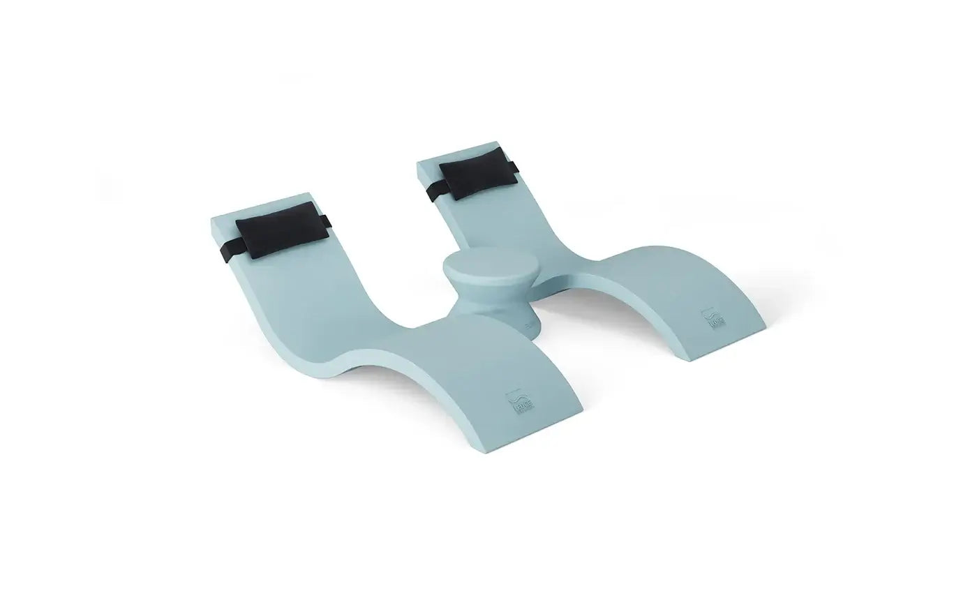 Designed for tanning ledges, baja shelves, or sun shelves with water depths up to 9 inches, this set includes two Signature In-Pool Chaise Loungers, two plush Headrest Pillows, and a versatile Side Table.