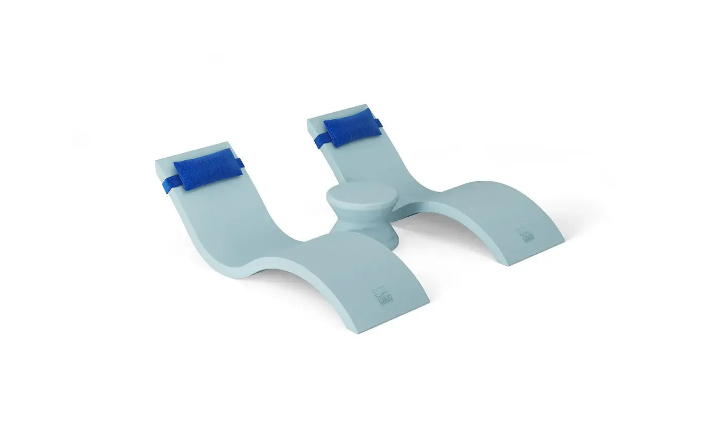 Designed for tanning ledges, baja shelves, or sun shelves with water depths up to 9 inches, this set includes two Signature In-Pool Chaise Loungers, two plush Headrest Pillows, and a versatile Side Table.