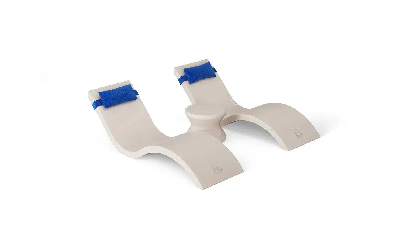 Designed for tanning ledges, baja shelves, or sun shelves with water depths up to 9 inches, this set includes two Signature In-Pool Chaise Loungers, two plush Headrest Pillows, and a versatile Side Table.