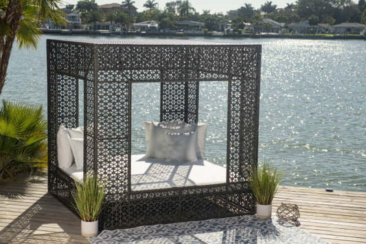 Panama Jack cube-shaped outdoor daybed built with weather-resistant materials to accommodate up to four people