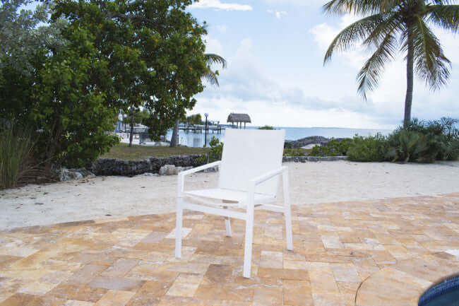 Panama Jack outdoor stackable armchair made with strong powder-coated finish resistant to corroding and scratching