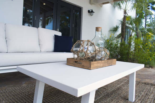 Panama Jack outdoor coffee table with glass made with strong powder-coated finish resistant to corroding and scratching