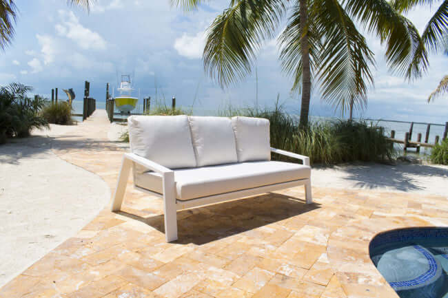 Panama Jack outdoor sofa made with strong powder-coated finish resistant to corroding and scratching