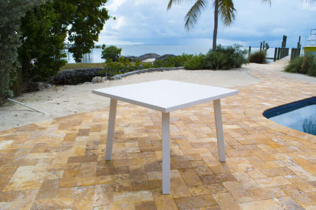Panama Jack square outdoor dining table made with strong powder-coated finish resistant to corroding and scratching