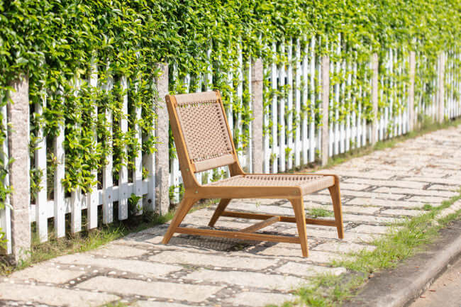 Panama Jack Adirondack chair made with solid Acacia wood construction and fast drying tan rope
